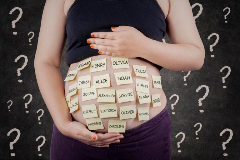 midsection-pregnant-woman-with-sticky-notes-abdomen-large