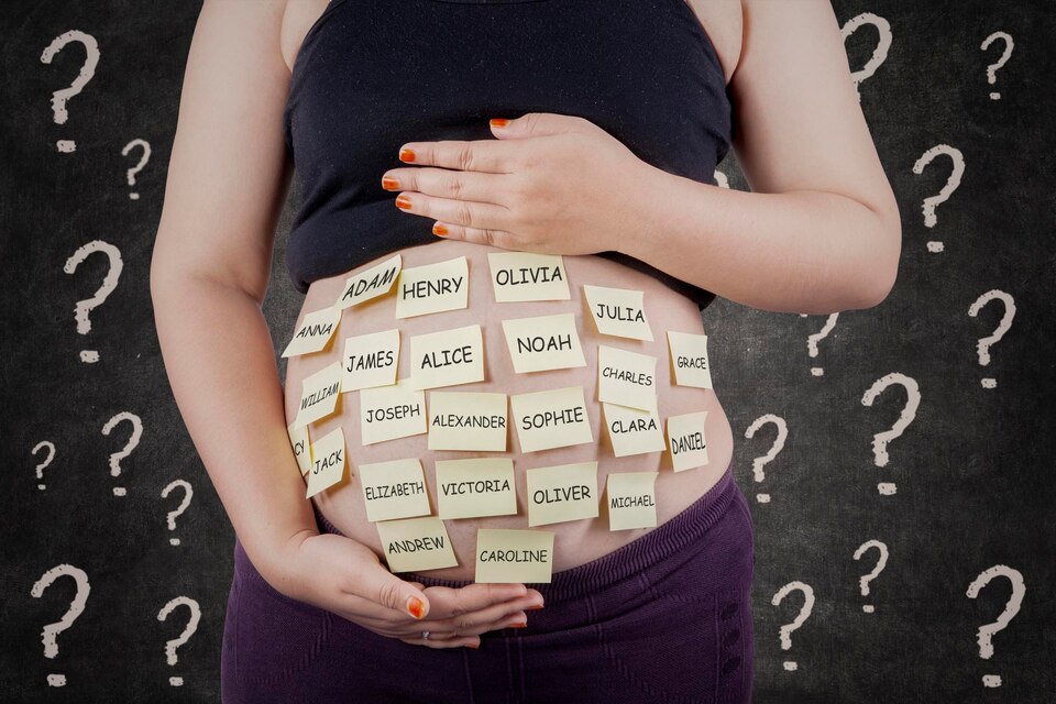 midsection-pregnant-woman-with-sticky-notes-abdomen-large